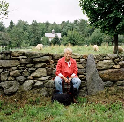 Diana Binghan-homeowner, farmer, social activist and philanthropist- rests with her Scottish terrier, Fiona, on a seat built into her remarkable stone wall by stonemason Ben Bowen.